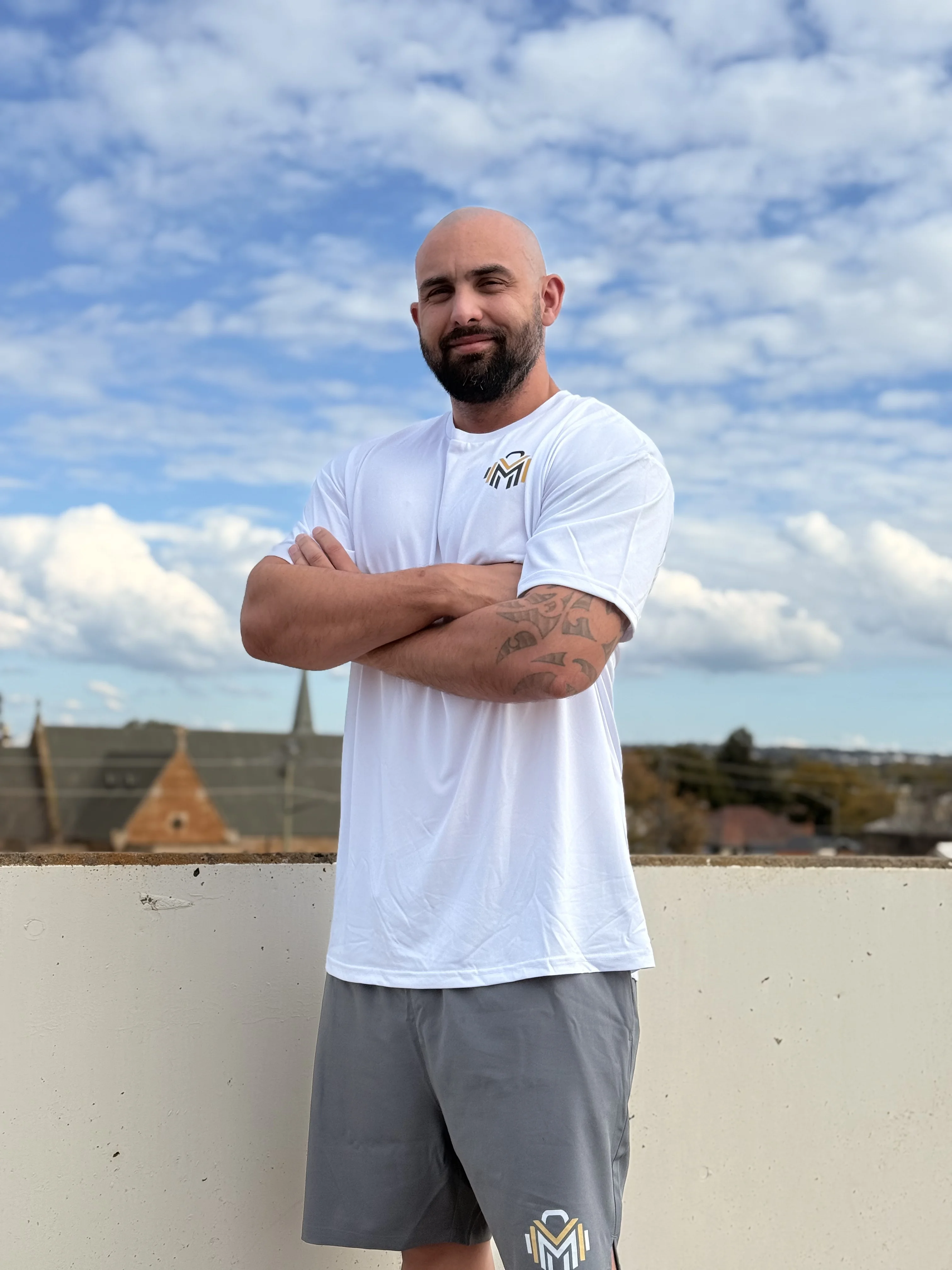 James standing in the gym after his 30kg transformation.